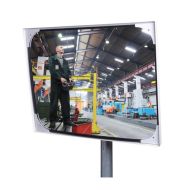 JISLON industriespiegel acryl 60 × 80 cm met lichte rand en weerspiegeling van medewerker in fabriekshal