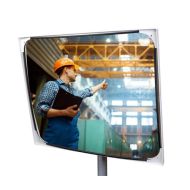 JISLON industriespiegel acryl 80 × 100 cm met lichte rand en weerspiegeling van medewerker in bedrijfshal